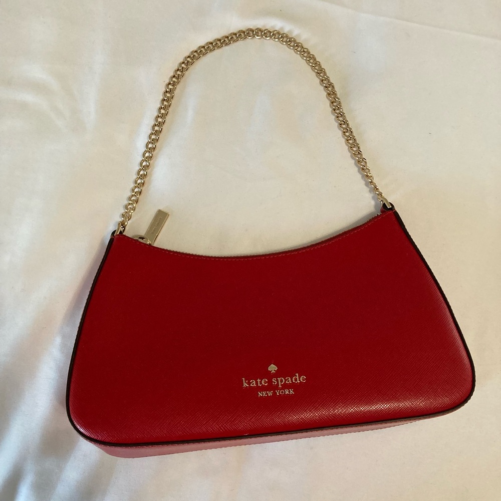 Red Kate Spade convertible crossbody bag